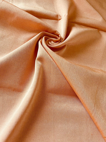 Hand-woven orange kutnu fabric. 44” wide.