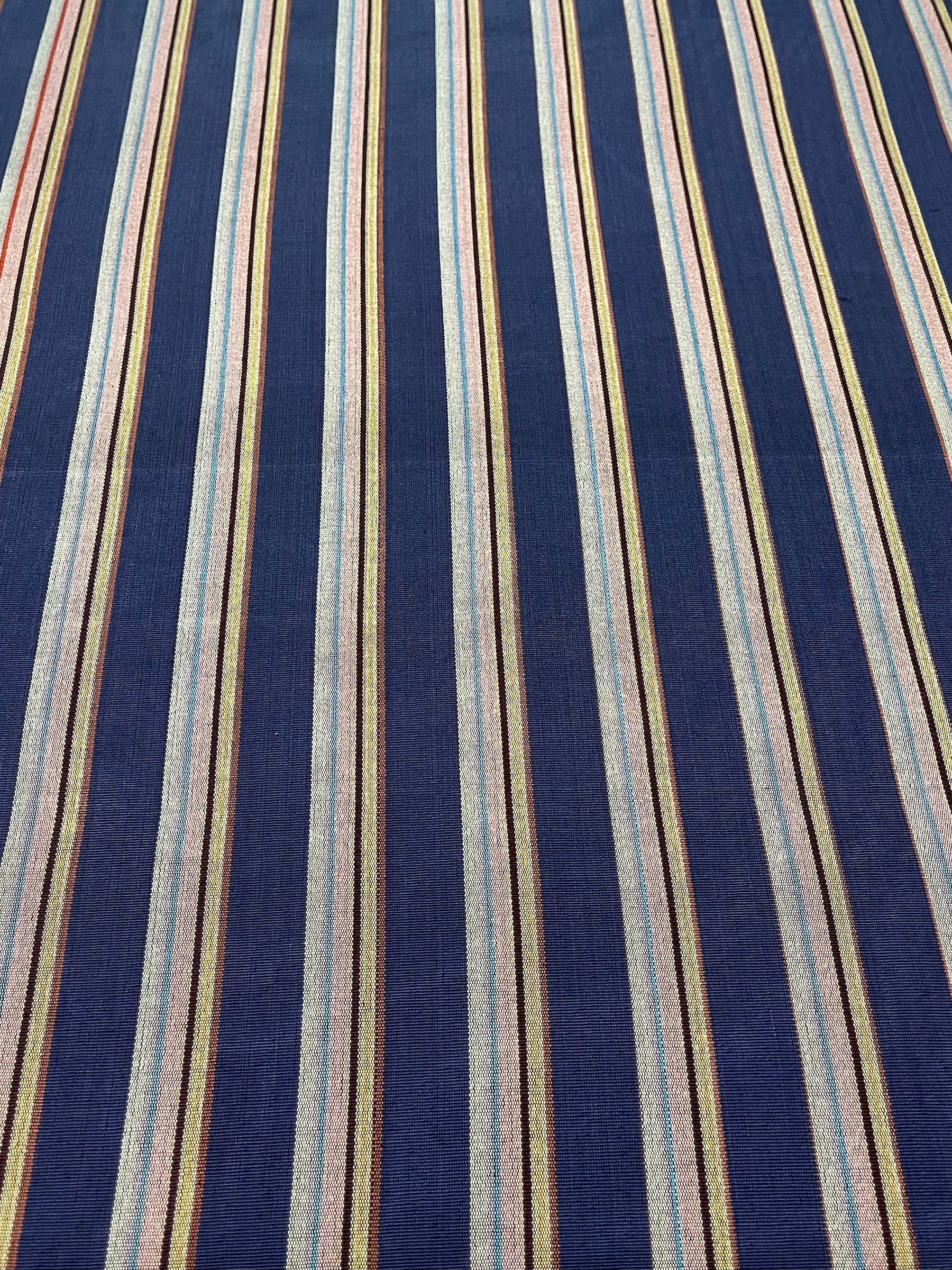Colorful striped woven kutnu fabric.